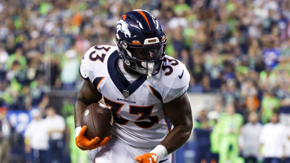 Sep 12, 2022; Seattle, Washington, USA; Denver Broncos running back Javonte Williams (33) runs for yards after the catch against the Seattle Seahawks during the fourth quarter at Lumen Field. Mandatory Credit: Joe Nicholson-USA TODAY Sports