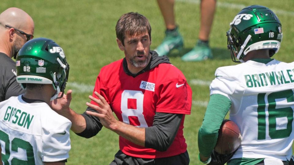 Florham Park, NJ May 31, 2023 -- Aaron Rodgers with Michael Carter and Jason Brownlee during the Jets OTA.