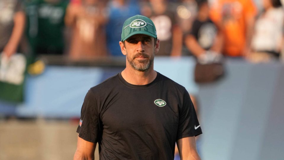 Aug 3, 2023; Canton, Ohio, USA; New York Jets quarterback Aaron Rodgers (8) watches from the sidelines during the first half against the Cleveland Browns at Tom Benson Hall of Fame Stadium. Mandatory Credit: Kirby Lee-USA TODAY Sports