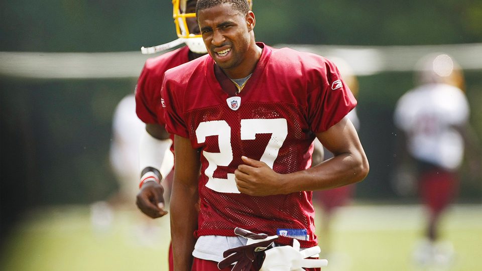 ** FILE ** In this July 29, 2008 file photo, Washington Redskins cornerback Fred Smoot changes fields during the Redskins football training camp in Ashburn, Va. Smoot, who never stops running his mouth, is having to run a bit more with his feet. A funny little secret was revealed about the Washington Redskins cornerback this week: He has never passed the team's conditioning test at the start of training camp.  (AP Photo/Gerald Herbert, File)