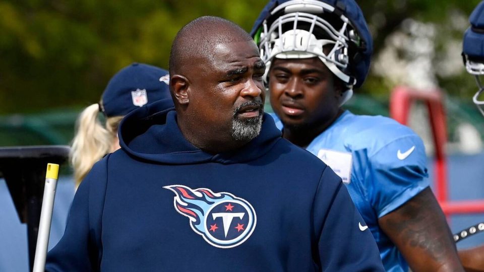 Tennessee Titans defensive line coach Terrell Williams walks with Shakel Brown, center, and Jayden Peevy, right, before starting the next drill during an NFL football training camp practice Tuesday, August 8, 2023, in Nashville, Tenn. Williams will be the Titans head coach for the preseason opener against the Chicago Bears.
