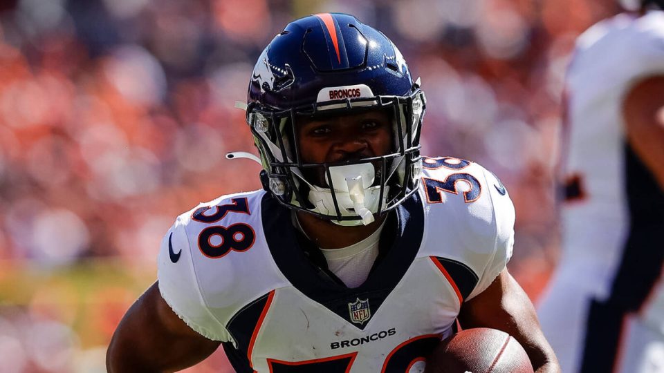 Sep 17, 2023; Denver, Colorado, USA; Denver Broncos running back Jaleel McLaughlin (38) runs for a touchdown in the first quarter against the Washington Commanders at Empower Field at Mile High. Mandatory Credit: Isaiah J. Downing-USA TODAY Sports