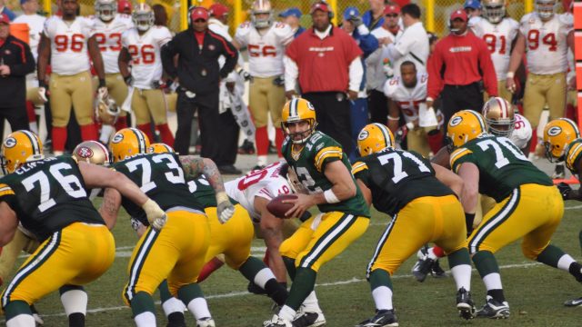 Green Bay Packers quarterback Aaron Rodgers takes the snap in a game at Lambeau Field against the San Francisco 49ers on November — Photo by herreid